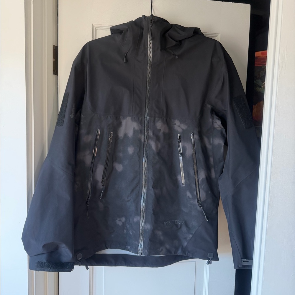 Arc'teryx Men's Black Hooded Shell Jacket with Subtle Washed Camo Pattern